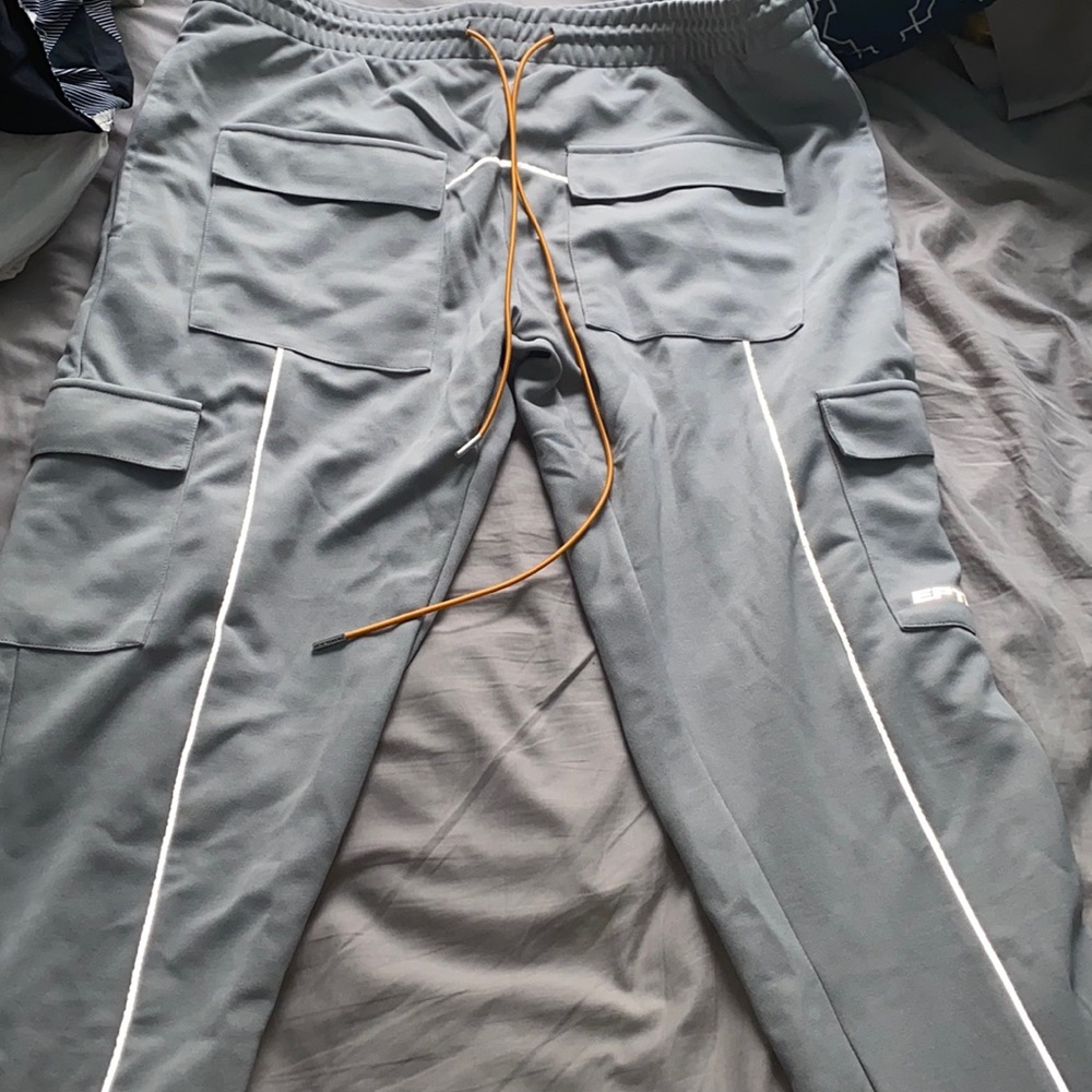 I have some grey EPTM pants they are reflective. Brand new never worn! Size XXL.